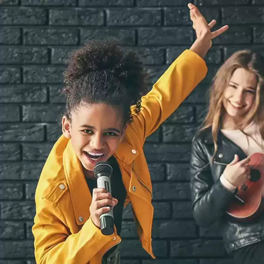 Two children in a singing lesson at Epic School of Music.